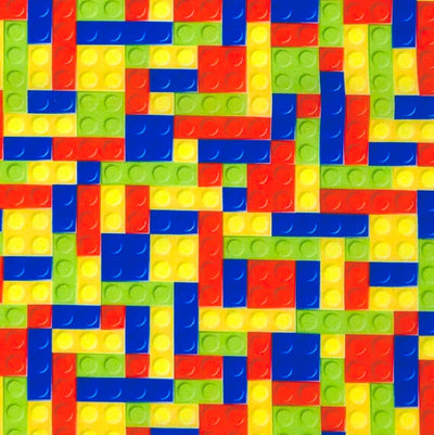 Pattern of colourful building blocks in a geometric arrangement on a polycotton fabric