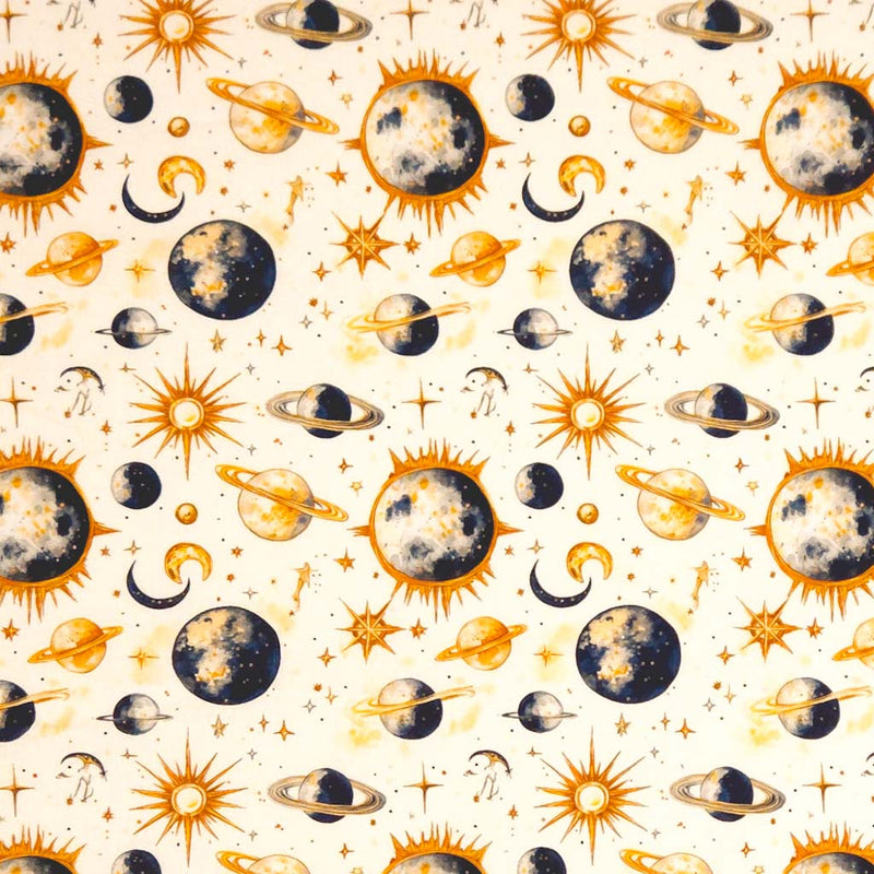Pattern of celestial bodies including suns, moons, and planets on a beige cotton fabric.