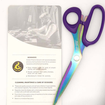 Scissors with purple handle on a white background
