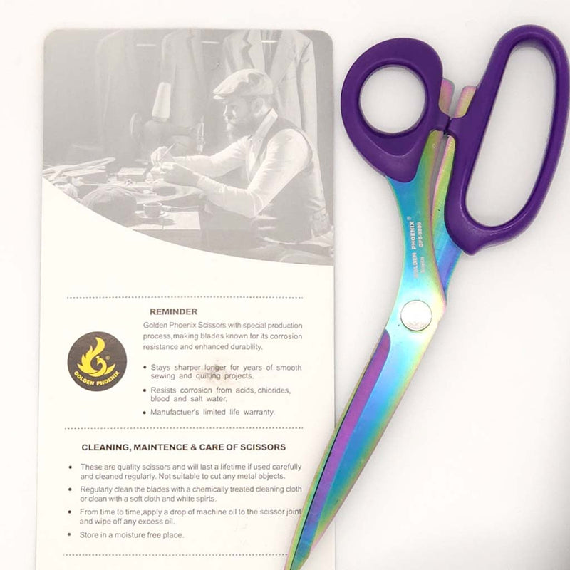 Scissors with purple handle on a white background