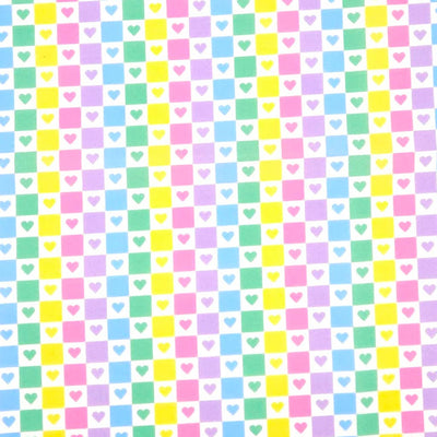 Hearts in a check pattern printed on polycotton fabric