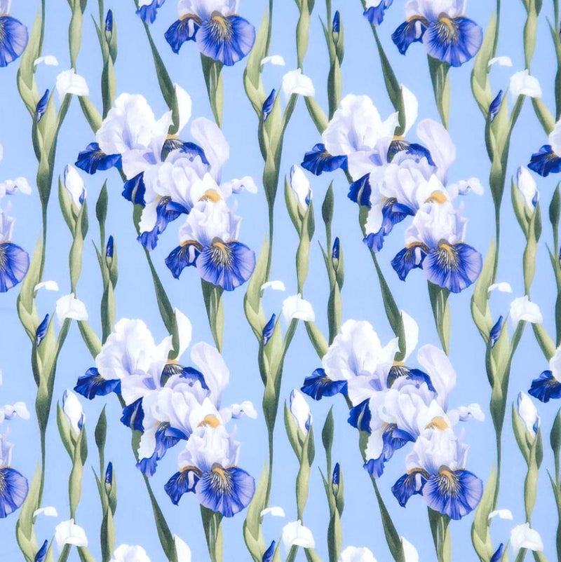 Pattern of blue and white flowers on a light blue polycotton fabric