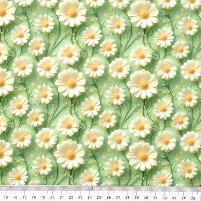 Pattern of white flowers with yellow centers on a green polycotton fabric, with a ruler at the bottom for scale.