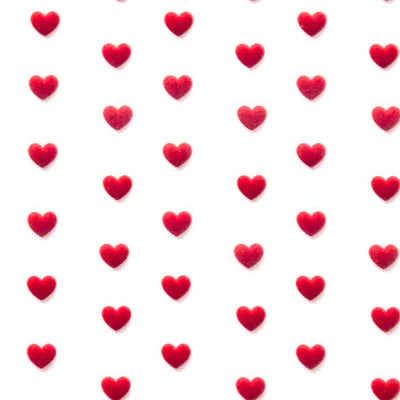 Pattern of red hearts on a white polycotton fabric