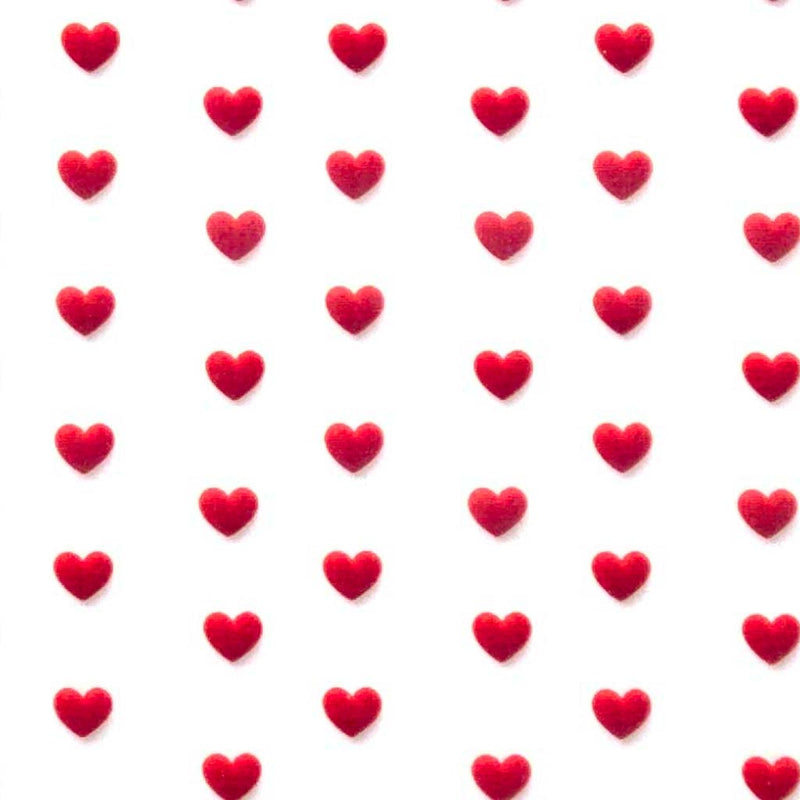 Pattern of red hearts on a white polycotton fabric
