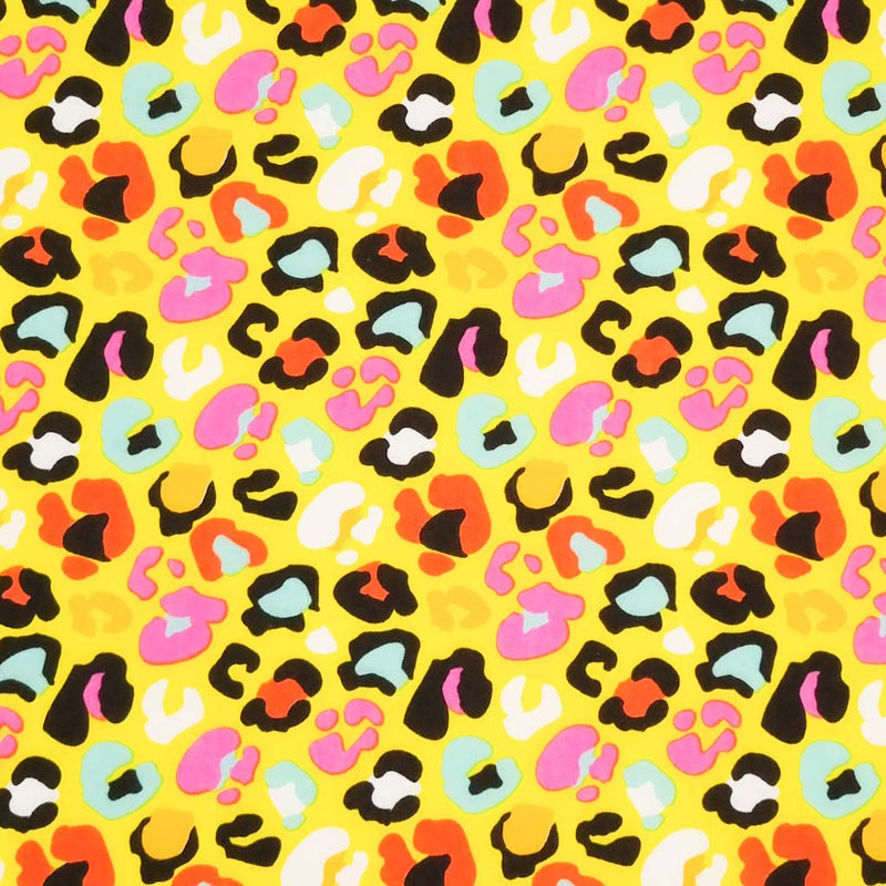 A fun leopard print with colourful leopard spots on a yellow polycotton.
