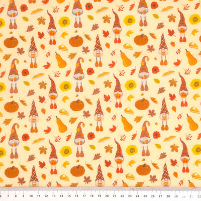 Gonks and pumpkins printed on an autumnal polycotton fabric with a cm ruler