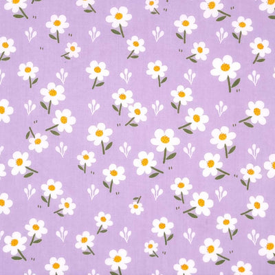 Pretty white daisies are printed on a lilac polycotton fabric