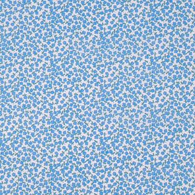 Ditsy blue flowers are printed on a white, quality polycotton fabric