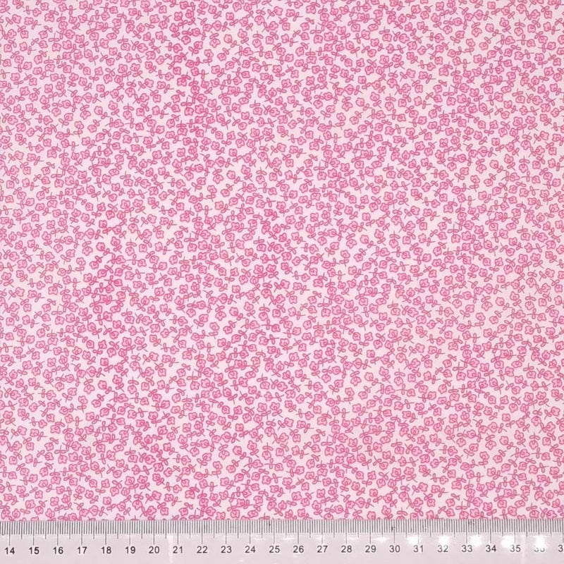 Ditsy pink flowers printed on a polycotton fabric