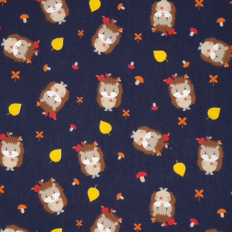 Cute hedgehogs and toadstools are printed on a navy polycotton fabric