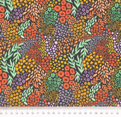 Bright plants in coral yellow and oranges, alongside neon teal vines on a contrasting black polycotton fabric with a cm ruler