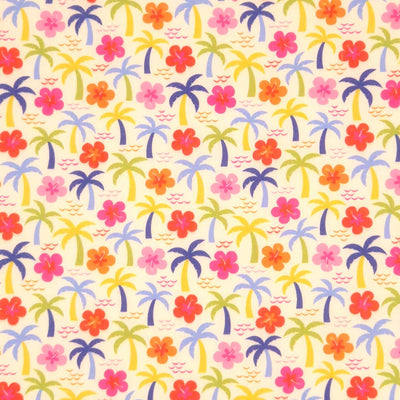 Palm trees and hibiscus printed on a cream polycotton fabric