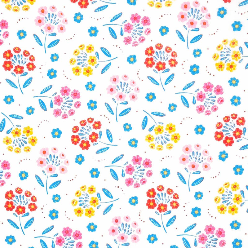 A floral design with flowers as petals printed on a white polycotton fabric