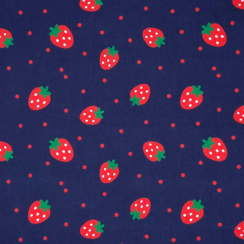 Spotty red strawberries with green stalks are printed on a navy blue polycotton fabric with scattered red spots.