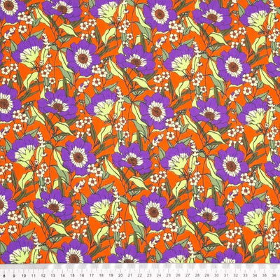 Blooming purple flowers are printed on an orange polycotton fabric with a cm ruler