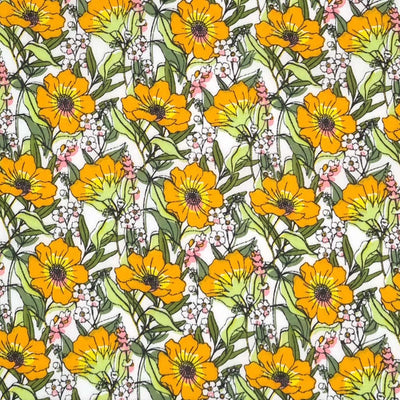 Blooming orange flowers are printed on a white polycotton fabric