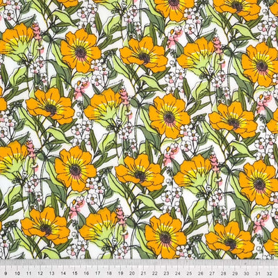 Blooming orange flowers are printed on a white polycotton fabric with a cm ruler