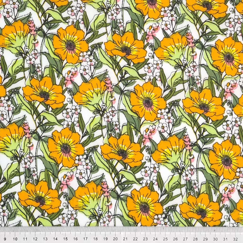 Blooming orange flowers are printed on a white polycotton fabric with a cm ruler