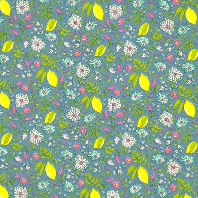 Lemons and ditsy flowers printed on a blue polycotton fabric