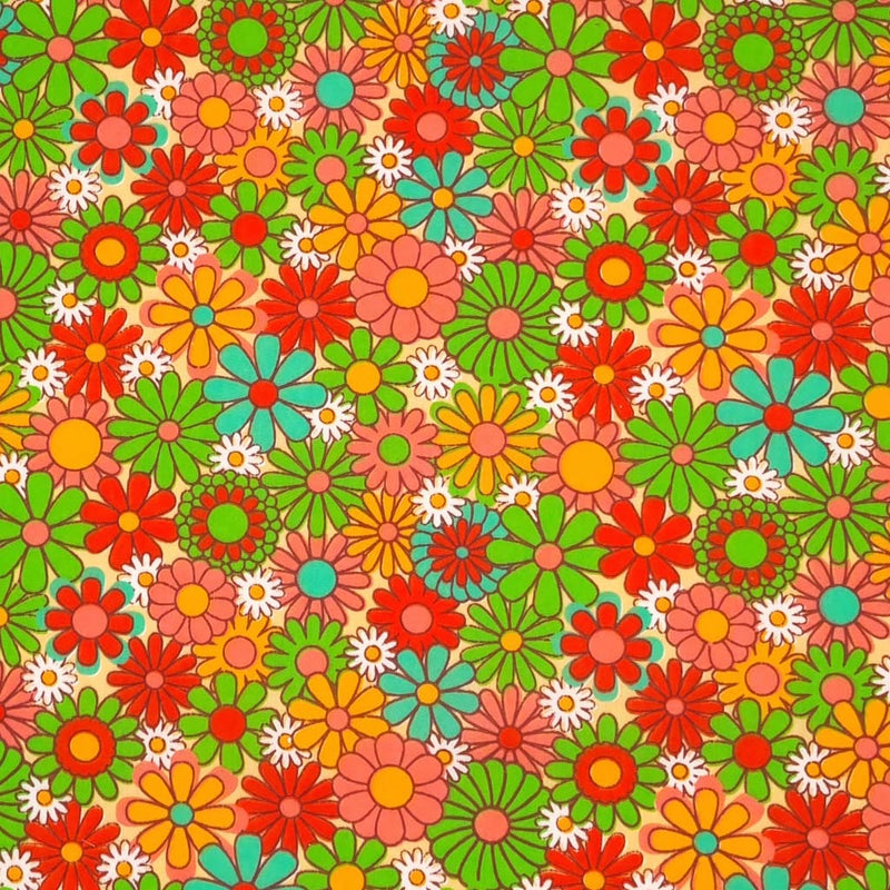 Colourful flowers with a retro vibe are printed on a sand coloured polycotton fabric