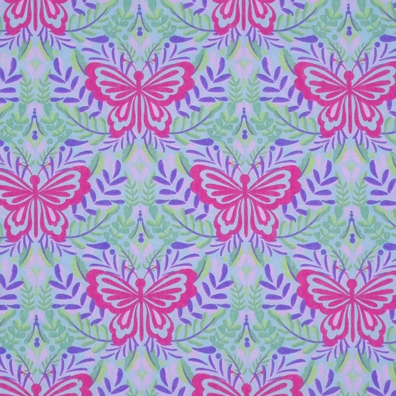 Large butterflies in cerise are printed on a lilac and sky blue coloured polycotton fabric