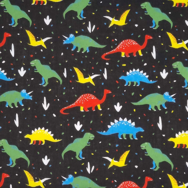 Colourful dinosaurs are printed on a black polycotton fabric