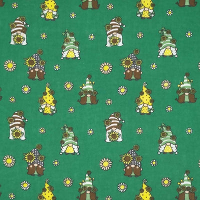 Cute little gonks with daisies are printed on a bottle green polycotton fabric