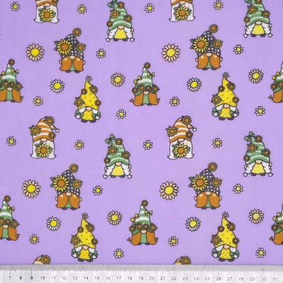 Cute little gonks with daisies are printed on a lavender coloured polycotton fabric with a cm ruler