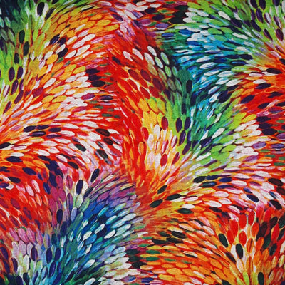 Rainbow coloured feathers are printed on a viscose ponteroma fabric