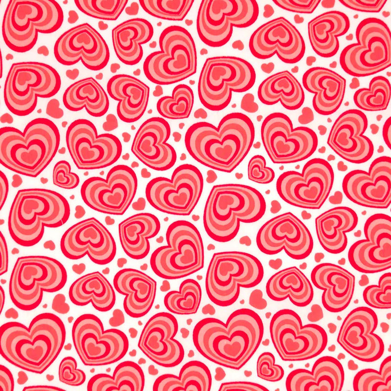 Red concentric hearts printed on a white polycotton fabric