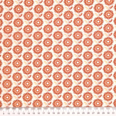 A geometric retro floral design printed on an ivory, 100% cotton poplin fabric with a cm ruler