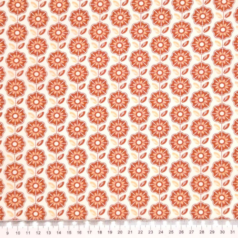 A geometric retro floral design printed on an ivory, 100% cotton poplin fabric with a cm ruler