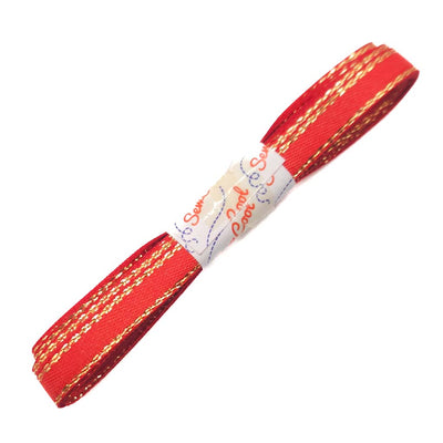 Red ribbon with gold stripes on a white background