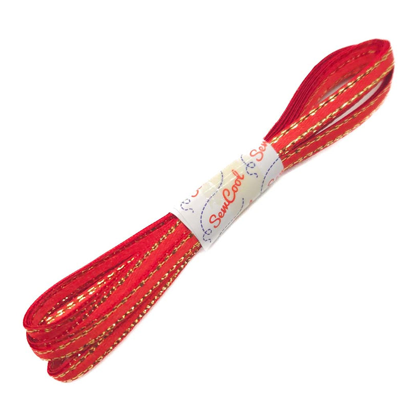 Red ribbon with gold thread on a white background