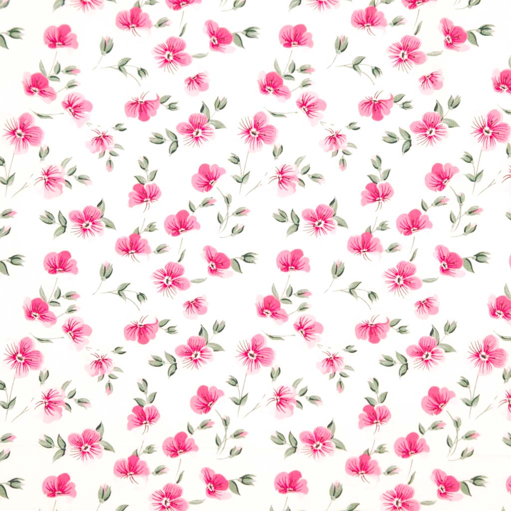 Pattern of small pink flowers with green leaves on a white background printed on a cotton poplin fabric