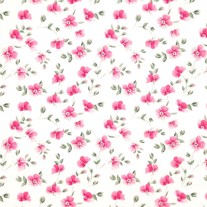 Pattern of small pink flowers with green leaves on a white background printed on a cotton poplin fabric