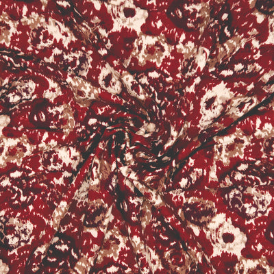 Close-up of a red and beige patterned fabric