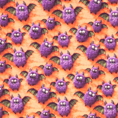 Pattern of purple bats on an orange cotton fabric
