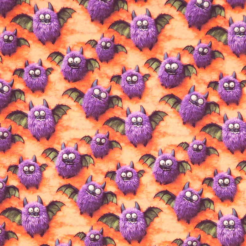 Pattern of purple bats on an orange cotton fabric