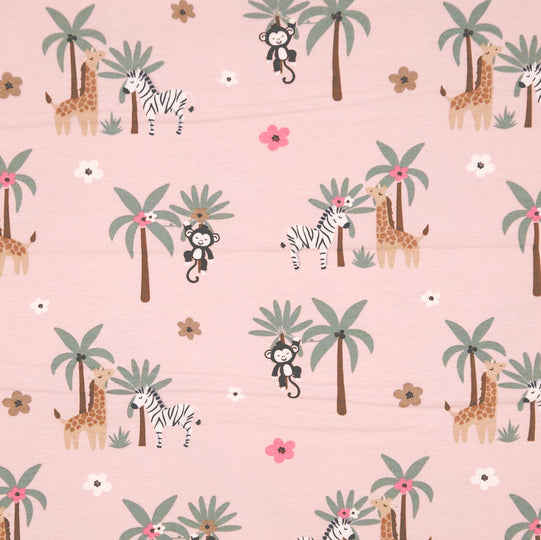 Monkeys and zebras printed on a pink cotton jersey fabric
