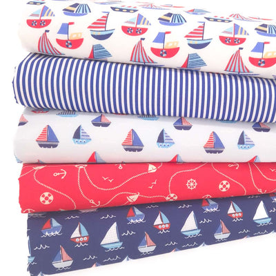 A fat quarter bundle with sailing boats and candy stripes