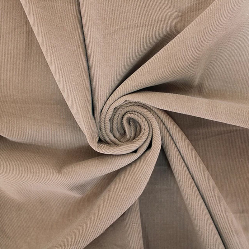 Sand coloured cotton needlecord fabric