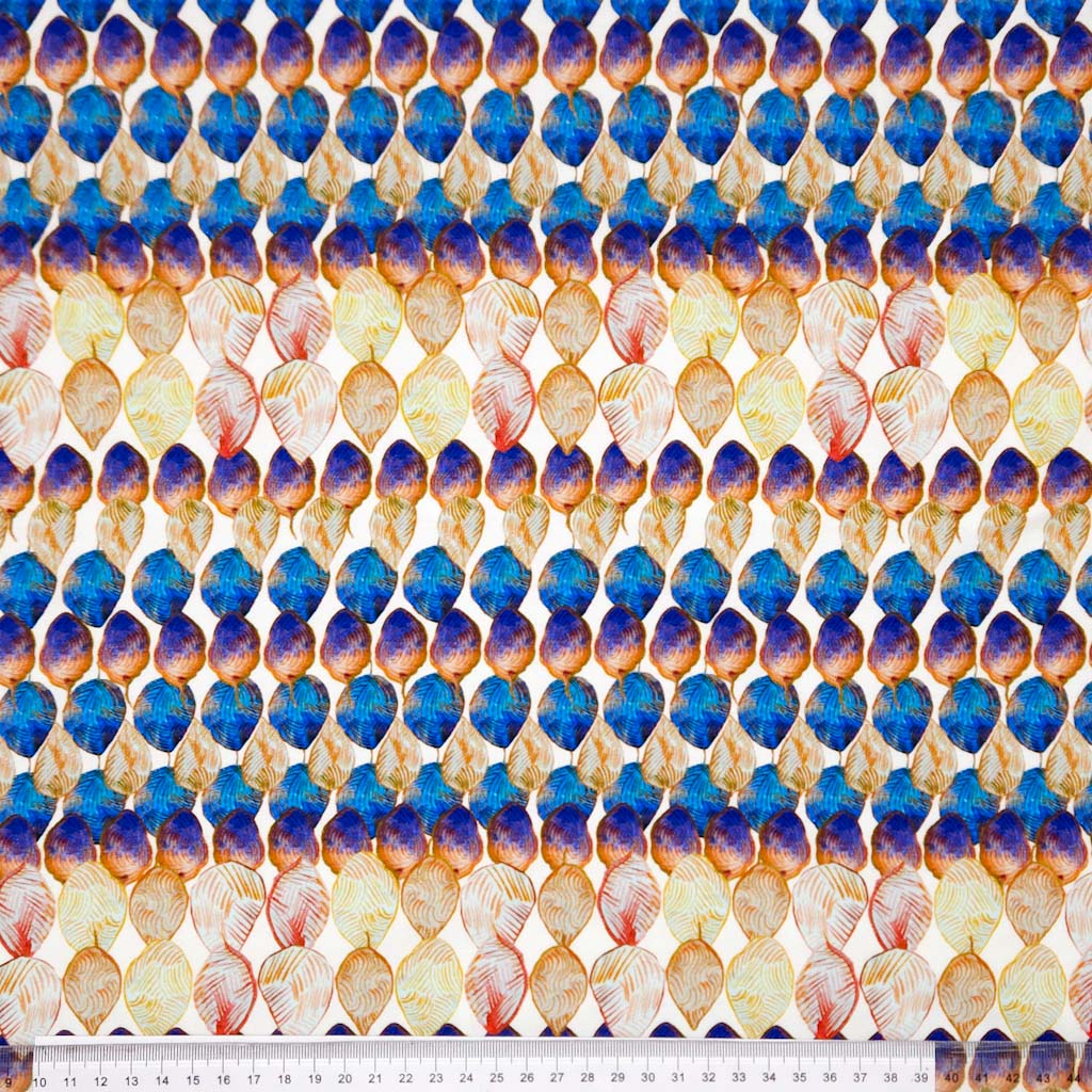 A shell design is printed on a cotton jersey fabric with a cm ruler