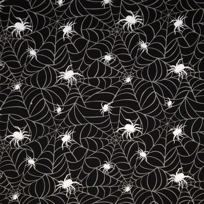 Pattern of white spiders and spider webs on a black polycotton fabric