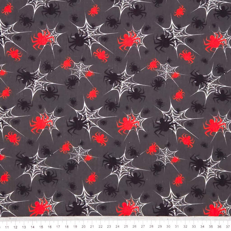 Halloween-themed fabric with spiders and webs on a gray halloween polycotton fabric.