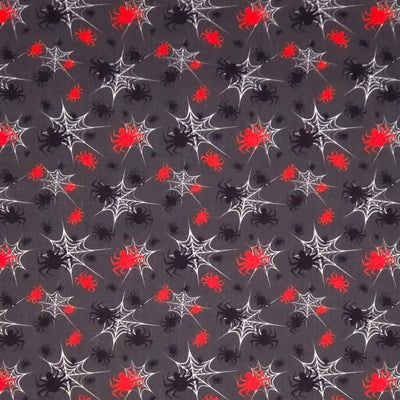 Pattern of black spiders, red berries, and white spider webs on a gray halloween polycotton fabric.