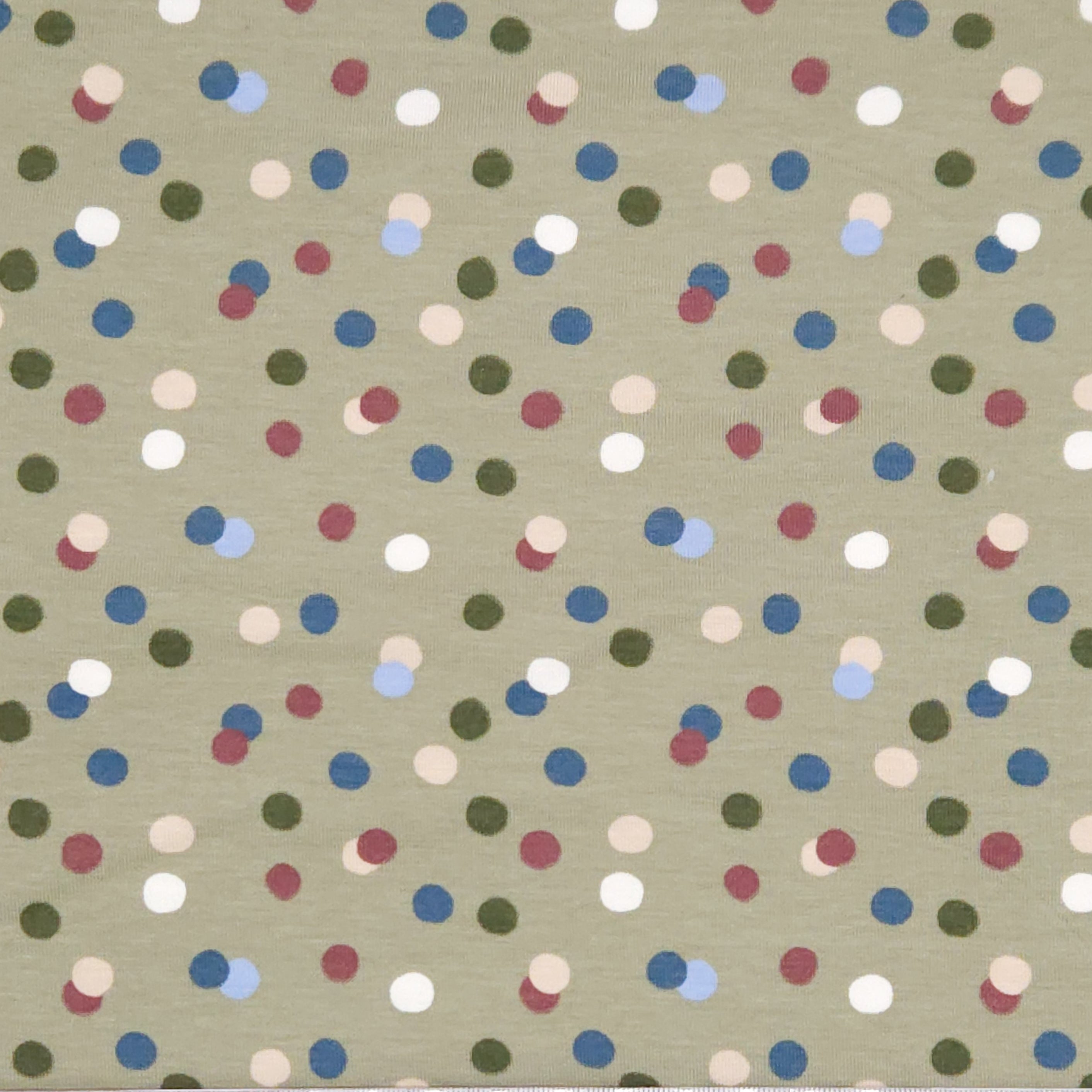 Dots printed on an olive green cotton jersey fabric