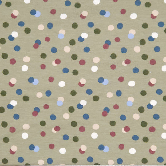 Dots printed on an olive green cotton jersey fabric