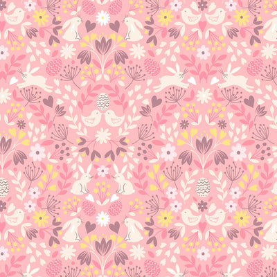 Bunnies and flowers are printed on a pink cotton fabric